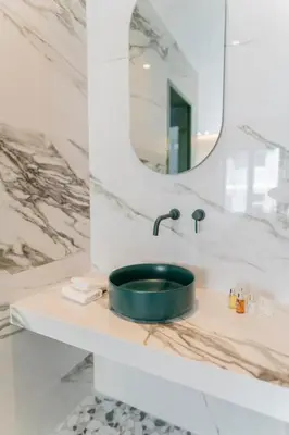 a bathroom with a sink and a mirror at Athens Retro in Athens