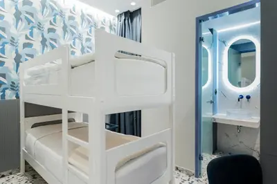 a white bunk bed in a bathroom with a mirror at Athens Retro in Athens