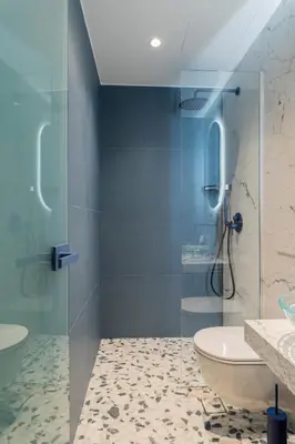 a bathroom with a glass shower and a toilet at Athens Retro in Athens
