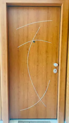 a wooden door with a clock on it at Ilisia mini suite in Athens