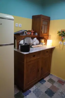 a kitchen with a counter top with a refrigerator at Retro private room in common apartment in Athens