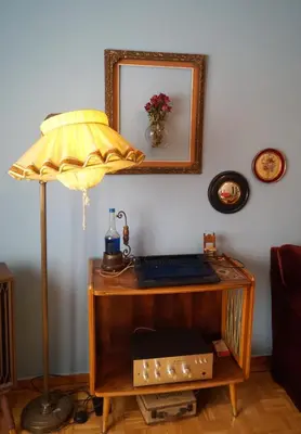 a desk with a lamp and a mirror on a wall at Retro private room in common apartment in Athens