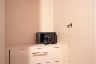 a small television sitting on top of a dresser at Downtown Penthouse With Gym And Acropolis View in Athens