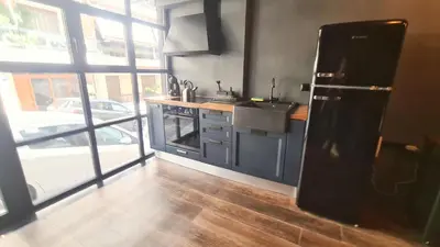 a kitchen with a sink and a counter top at The Black key in Athens