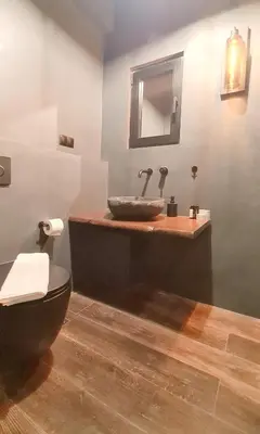 a bathroom with a sink and a toilet at The Black key in Athens