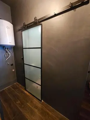a sliding glass door in a room at The Black key in Athens