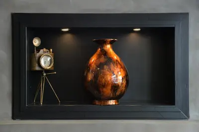 a vase sitting on a shelf next to a camera at Alter Athens in Athens