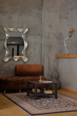 a living room with a couch and a mirror at Alter Athens in Athens