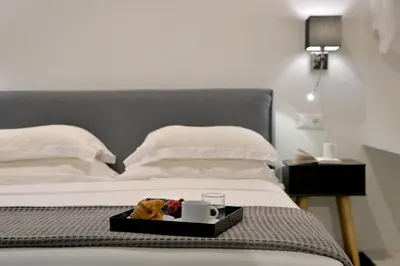 a tray with a teddy bear on a bed at Alter Athens in Athens