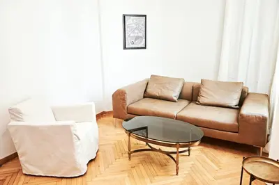 a living room with a couch and a table at Perikleous Apartment in Athens