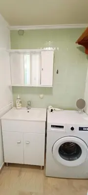 a kitchen with a washing machine and a sink at Dafni's Super Home in Athens