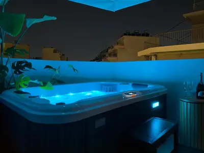 a blue bath tub with an aquarium in a room at Airrent Apartments 1 The Athens Jacuzzi Lounge in Athens
