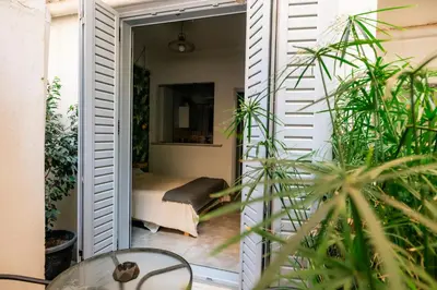 a room with a door leading to a bedroom at The Athens Green Apt in Athens