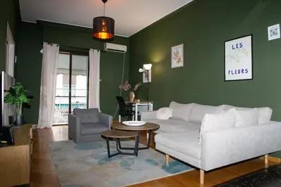 a living room with a couch and a table at P23 by SpitiSou in Athens