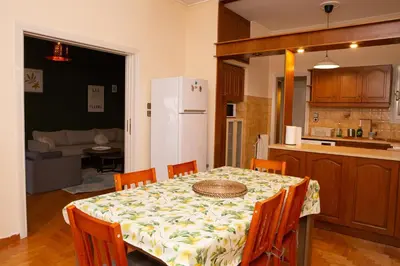 a kitchen and dining room with a table and chairs at P23 by SpitiSou in Athens