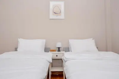 two beds sitting next to each other in a room at P23 by SpitiSou in Athens
