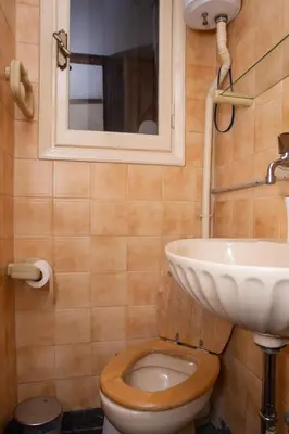 a bathroom with a toilet and a sink at P23 by SpitiSou in Athens