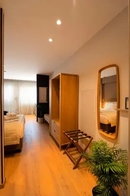a bedroom with a bed and a mirror at Psiri 38 Boutique Balcony Suite in Athens