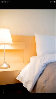 a bedroom with a bed with a lamp next to it at Beautiful Victoria in Athens