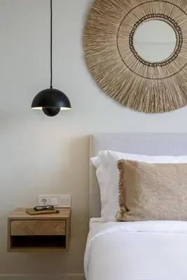 a bedroom with a bed with a mirror and a table at Acropolis Dream with Plunge Pool in Athens