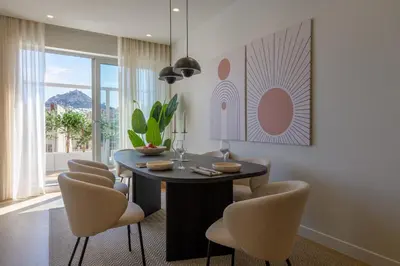 a dining room with a round table and chairs at Acropolis Dream with Plunge Pool in Athens