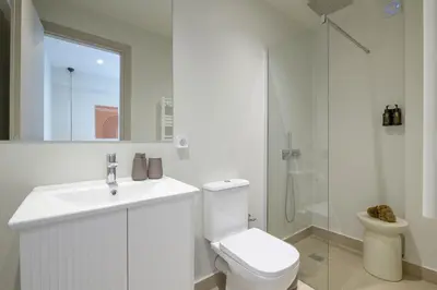 a bathroom with a toilet and a sink and a shower at Acropolis Dream with Plunge Pool in Athens