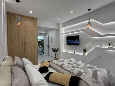 a living room with a couch and a tv at Stylish Athens Base near Acropolis & Metro in Athens