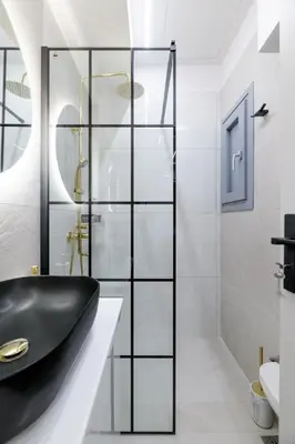 a bathroom with a black sink and a shower at The Athens Getaway Apartment GF in Athens