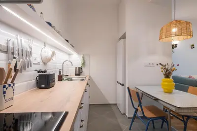 a kitchen with a table and a dining room at 1BR Next to Metro Modern Comfort in Athens