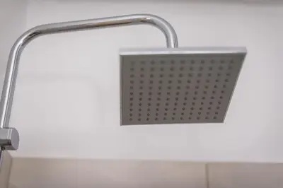 a bathroom sink with a metal shower head at Cozy home in the heart of Athens in Athens