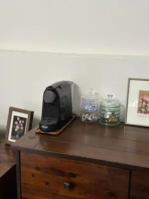 a television sitting on top of a wooden table at Zoy's house in Athens