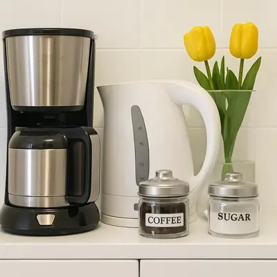 a coffeemaker and a coffee maker on a counter at Saronida BEACH STUDIO in Saronida