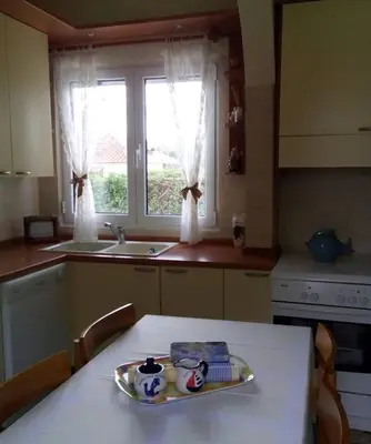 a kitchen with a table with a plate on it at Lagonissi Summer House in Lagonissi