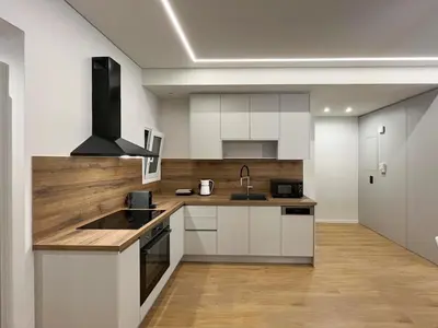 a kitchen with white cabinets and a sink at 3BR Modern & Spacious apt in Athens