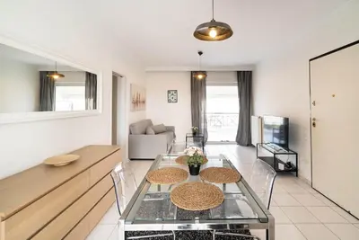 a living room with a table and a couch at La Casa De Los Dioses Athens in Athens