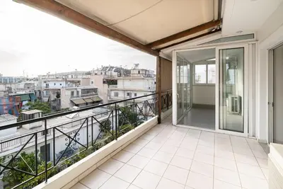 an apartment balcony with a view of the city at La Casa De Los Dioses Athens in Athens