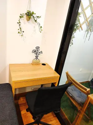 a desk and a chair in a room at Central apartment in Athens in Athens