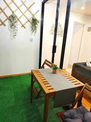 a living room with a table and a couch at Central apartment in Athens in Athens