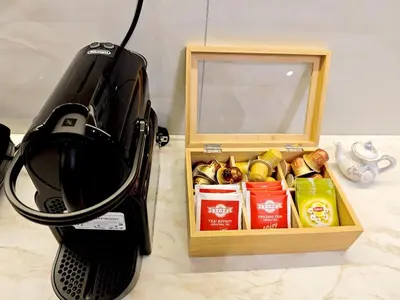 a microwave oven next to a box of food at Central apartment in Athens in Athens