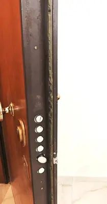 a door with a bunch of buttons on it at Central apartment in Athens in Athens