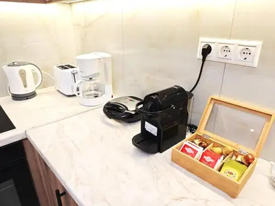 a kitchen counter with a phone and a box on it at Central apartment in Athens in Athens