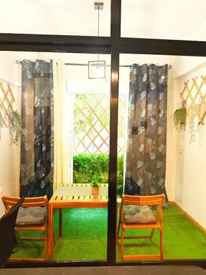 a room with a table and chairs and a window at Central apartment in Athens in Athens