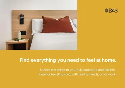 a poster for a hotel room with a bed with at B48 Athens Dafni in Athens