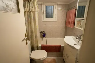 a bathroom with a toilet and a sink at 15' to Sea & Acropolis in Athens