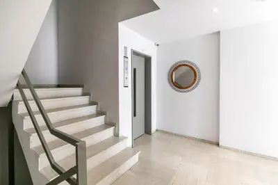 a hallway with stairs and a mirror on the wall at Andromeda - 1 Bedroom Apt & Terrace in Athens in Athens