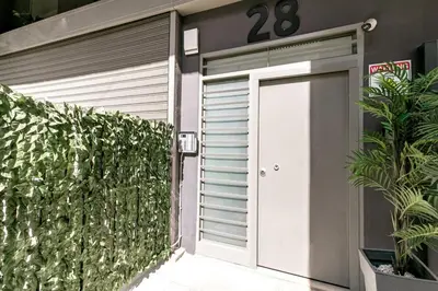 a garage door with the number on it at Andromeda - 1 Bedroom Apt & Terrace in Athens in Athens