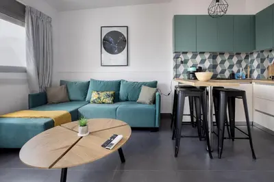 a living room with a couch and a table at Andromeda - 1 Bedroom Apt & Terrace in Athens in Athens