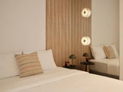 a hotel room with two beds and two lamps at Modern Nest Studio in Syntagma in Athens