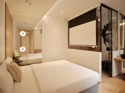 a bedroom with a white bed and a mirror at Modern Nest Studio in Syntagma in Athens