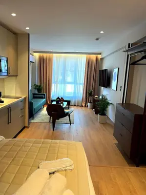 a large living room with a couch and a table at Psiri 48 Boutique Suite in Athens